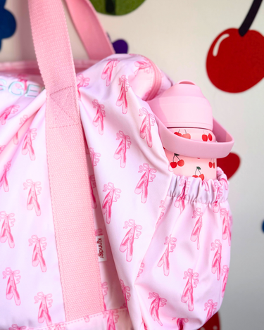 duffle bag in tiny dancer print with a cherry drink bottle