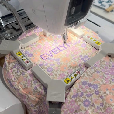 a blossom mini backpack with embroidered name evelyn