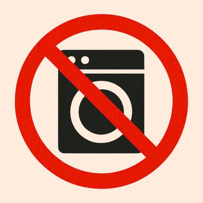 Prohibition sign with a washing machine icon inside a red circle on a beige background